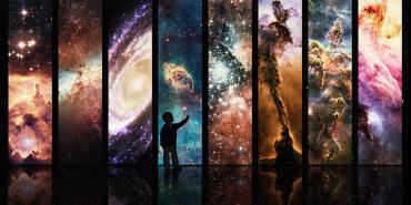 Tall banner exhibits of astronomical images with a silhouette of a child