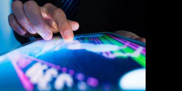 A finger touching a screen