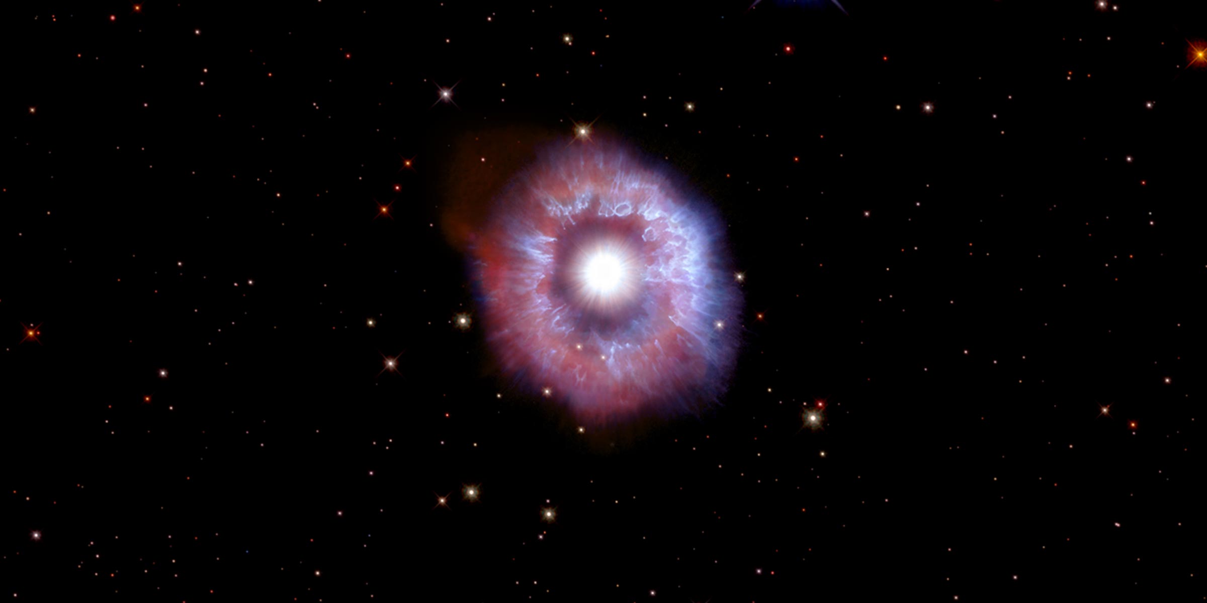 Bright star surrounded by shell of gas and dust