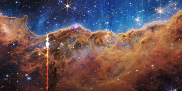 Video still showing a glowing vertical line as it sweeps across a near-infrared image that has been sonified.