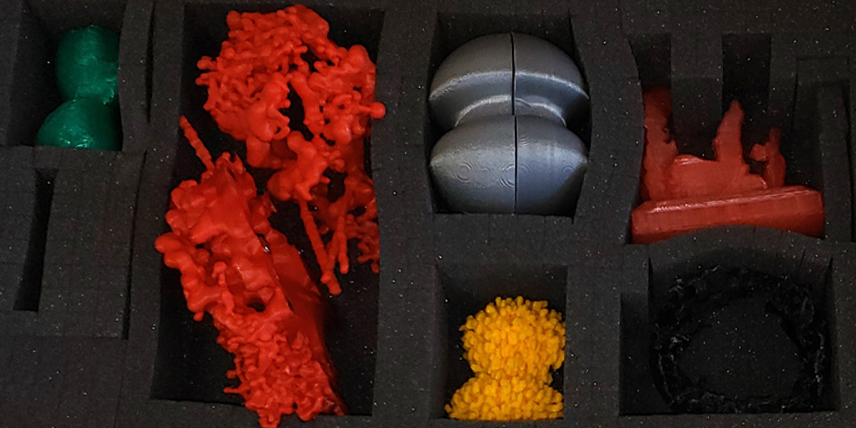 Five plastic objects in a box