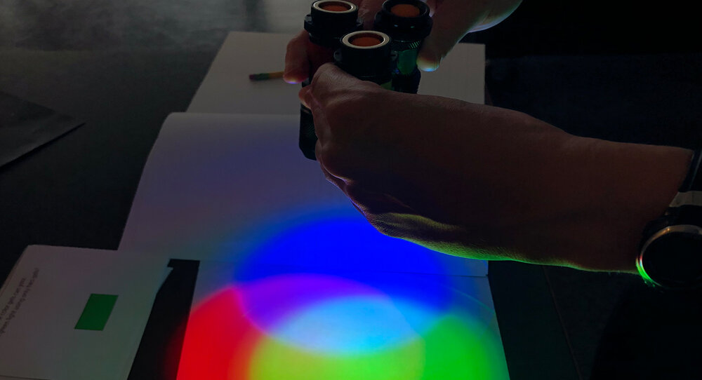 A paper and light activity with binoculars